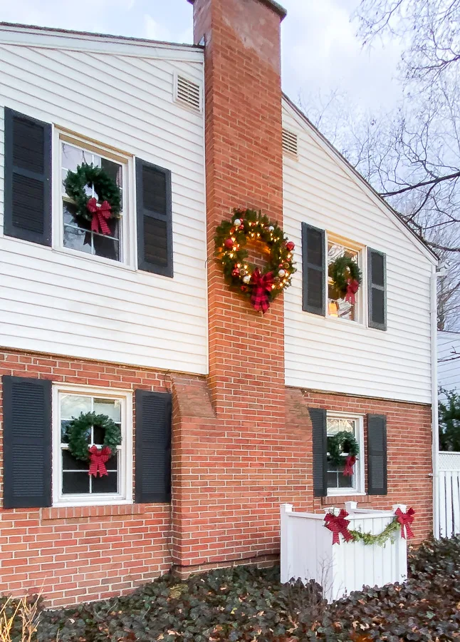 christmas wreath on chimney, christmas wreaths on windows