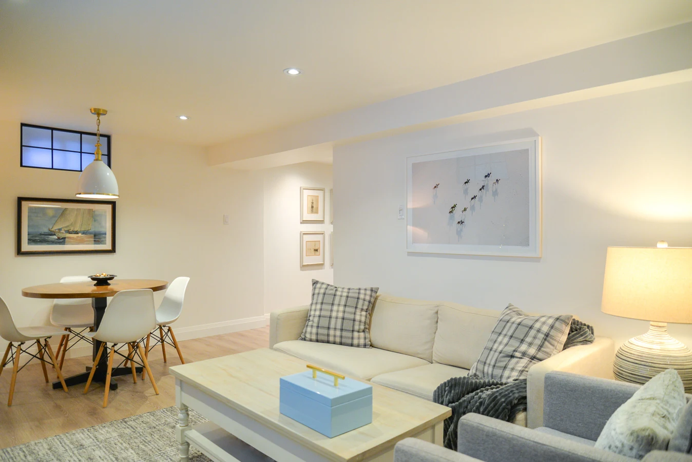 white basement family room with games table
