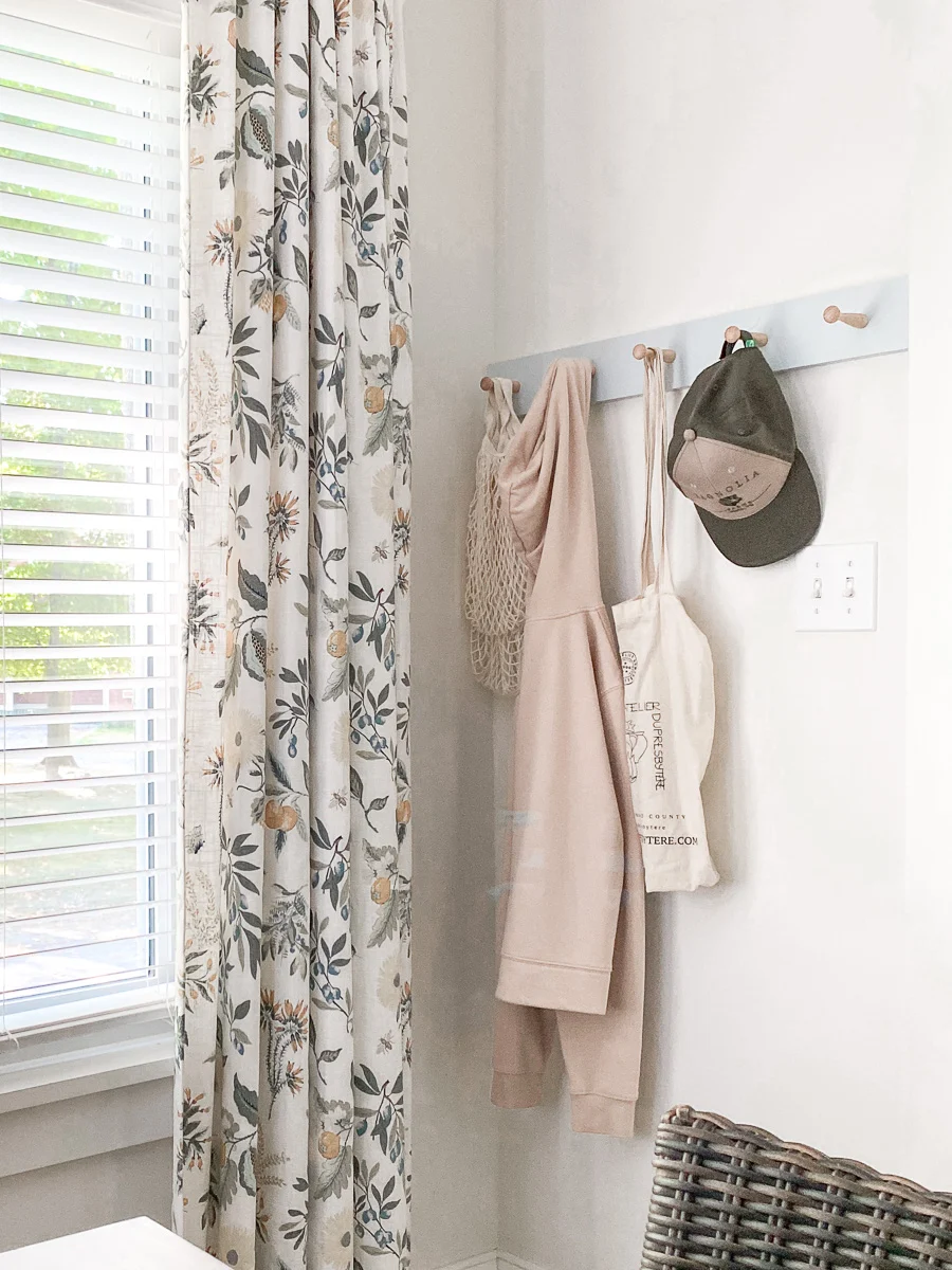 farmhouse table x-base dining room with floral curtains