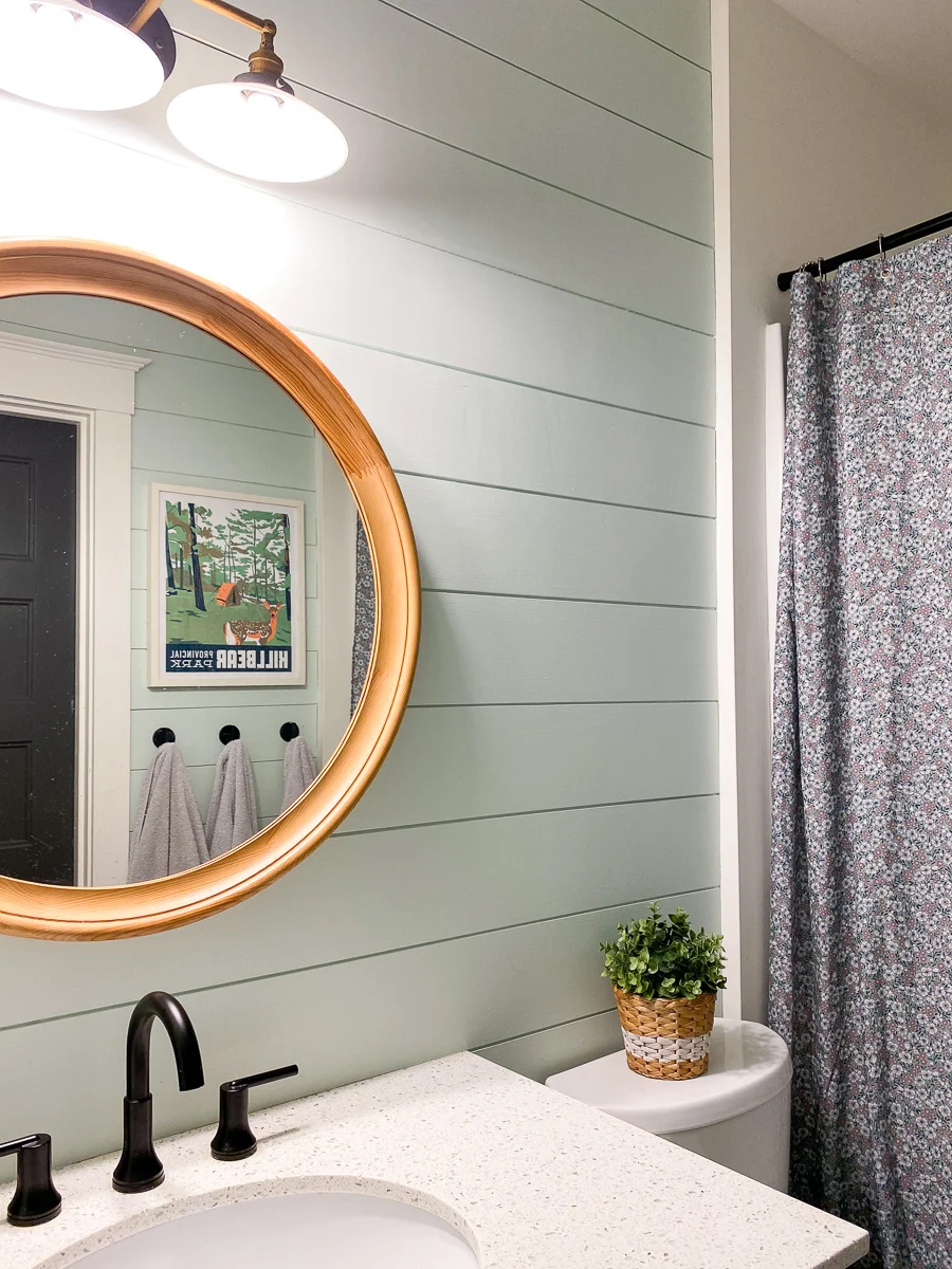cottage bathroom with shiplap walls