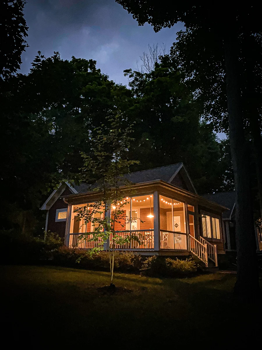 cottage screened in porch at night