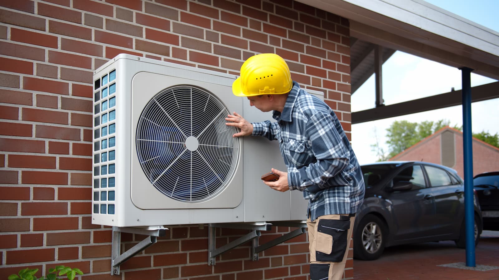 Air Source heat pump fitted outside a new home development
