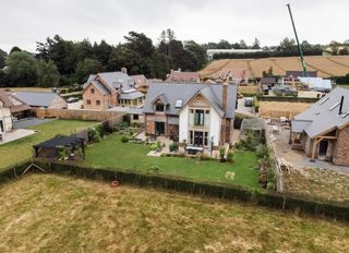 A custom build development of oak framed homes on green fields