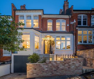 front garden design with brick wall and planting