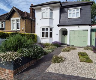 front garden design with gravel landscaping and wheelie bin screen