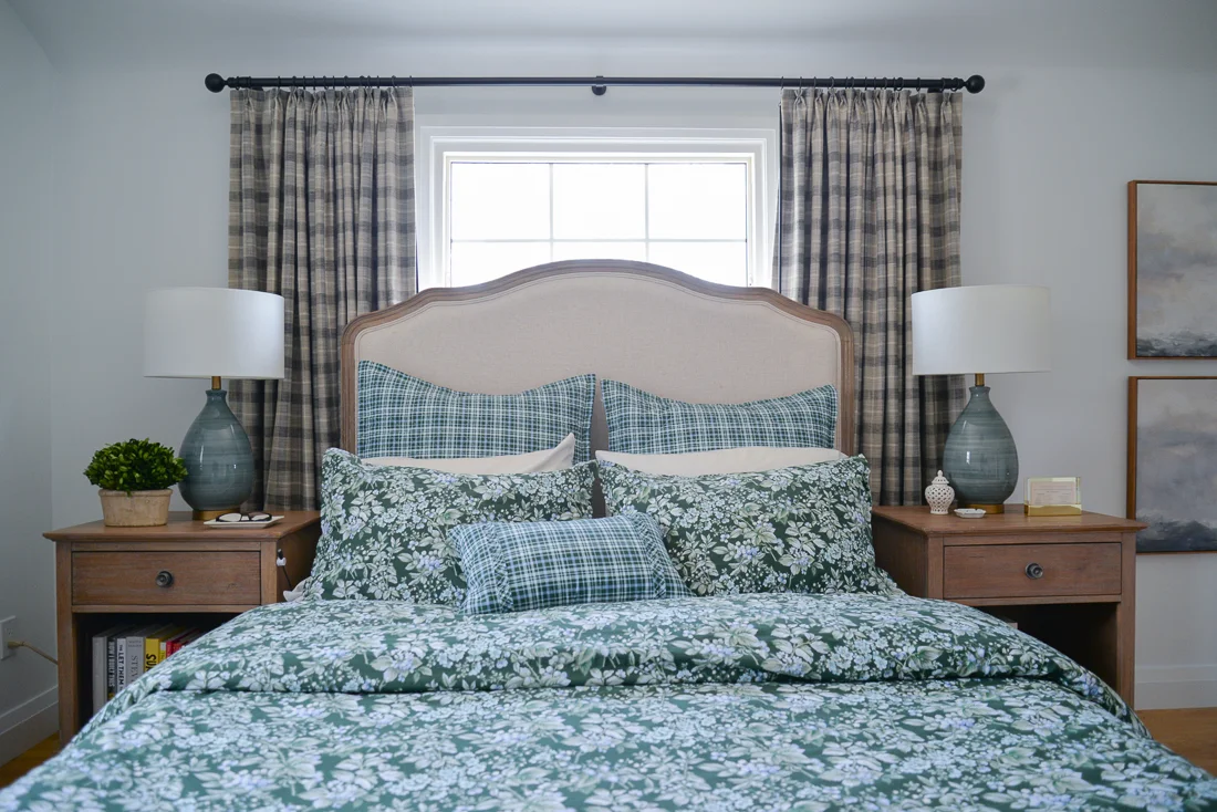 bed in front of window, large headboard bed, upholstered headboard