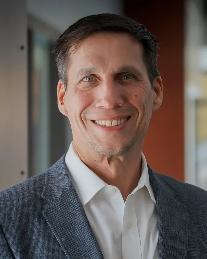 A headshot of Trent Mostaert