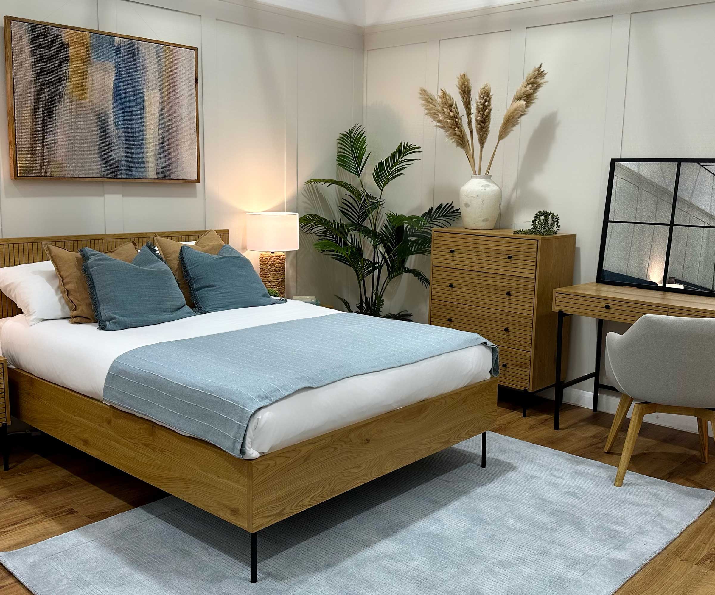 bedroom with engineered wood flooring and wooden furniture