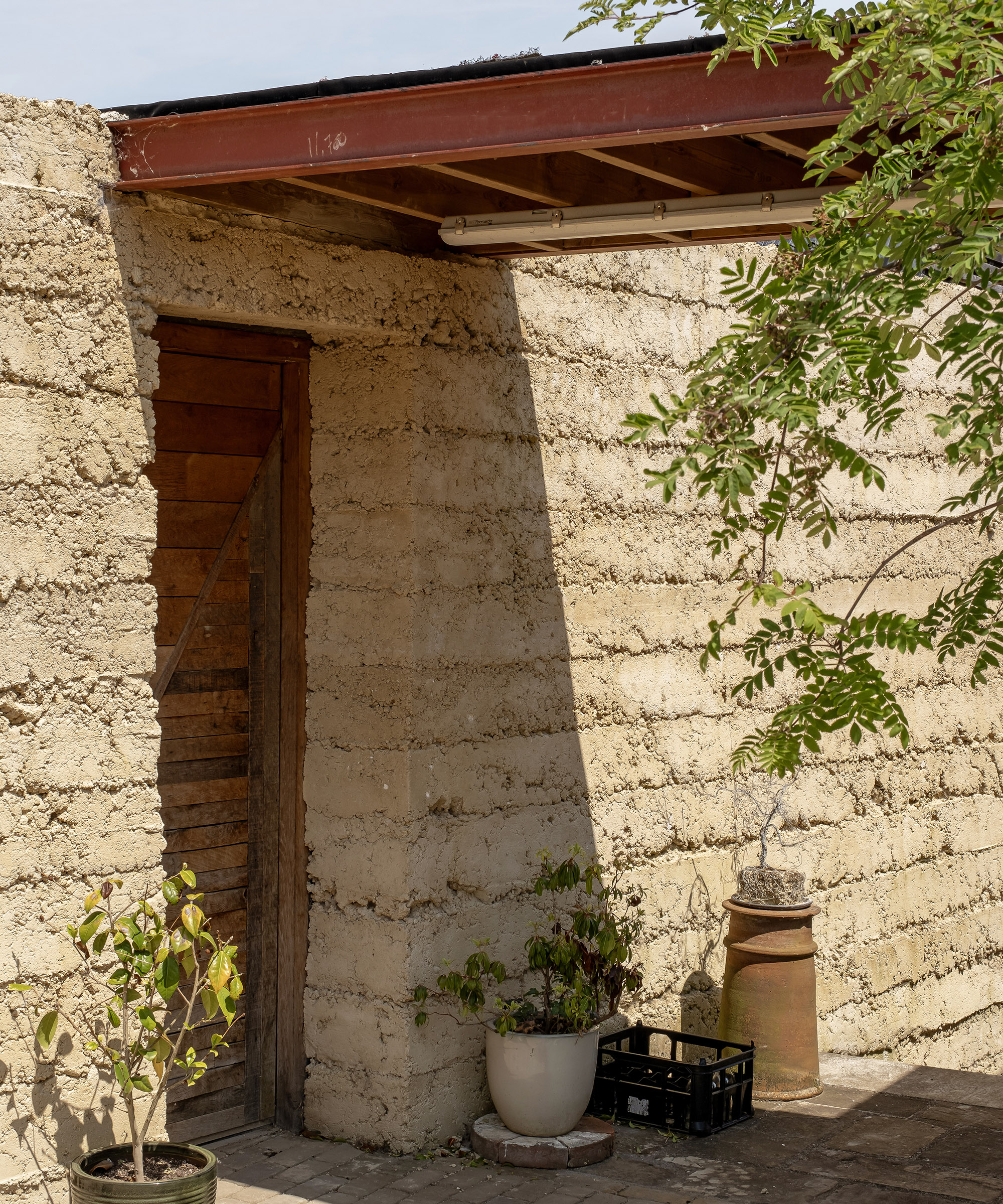A rammed brick wall made from building waste