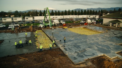 SK Construction had existing buildings on three sides of the project. Contractors were given one fact to access work.