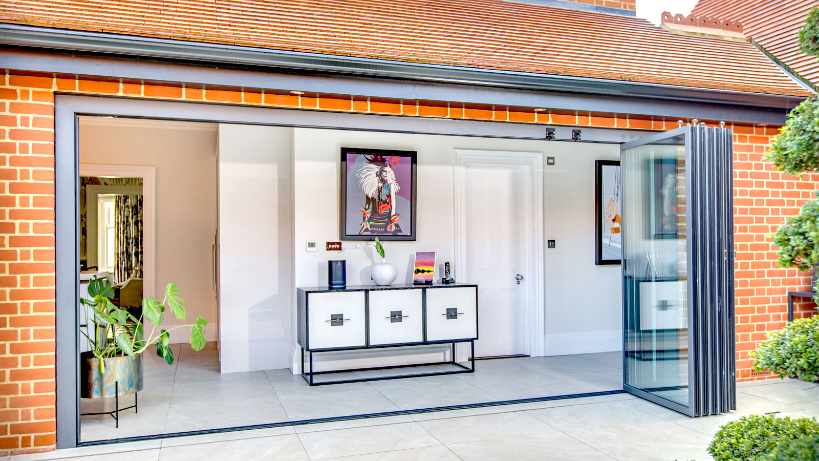Multiple doors on IDSystem slide and turn door system installed on extension at the back of home
