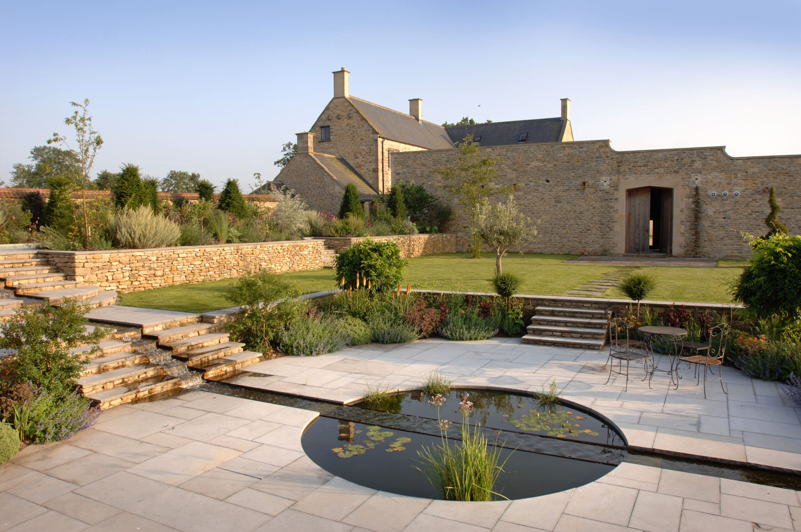 garden design with circular patio and water feature