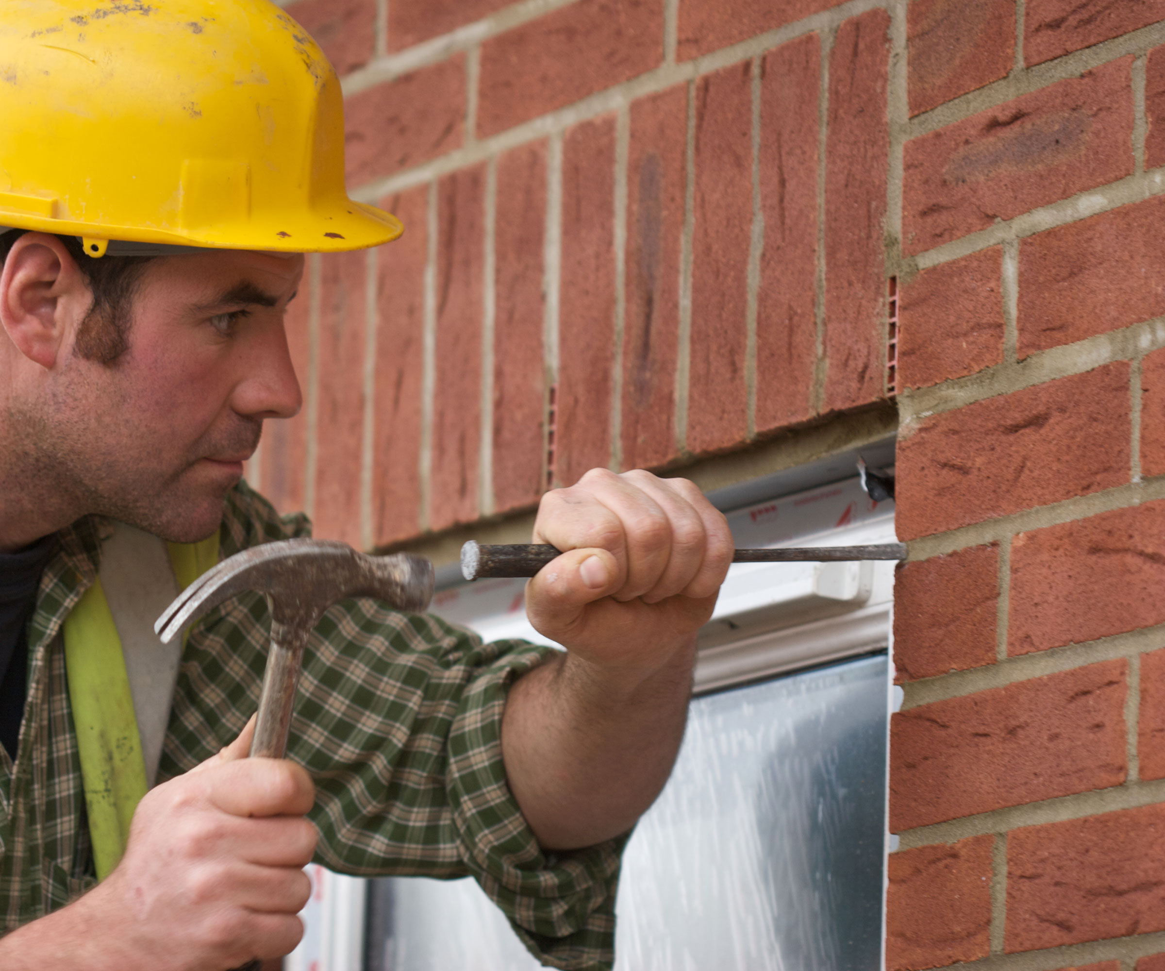 man removing a window