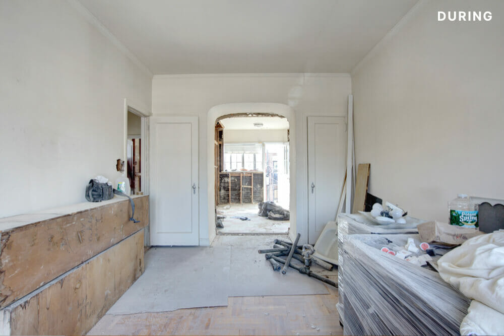Arched walkway between two closed closet during renovation