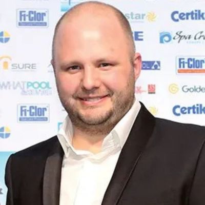 Headshot of Alex Kemsley, MD of Compass Pools, at a formal event