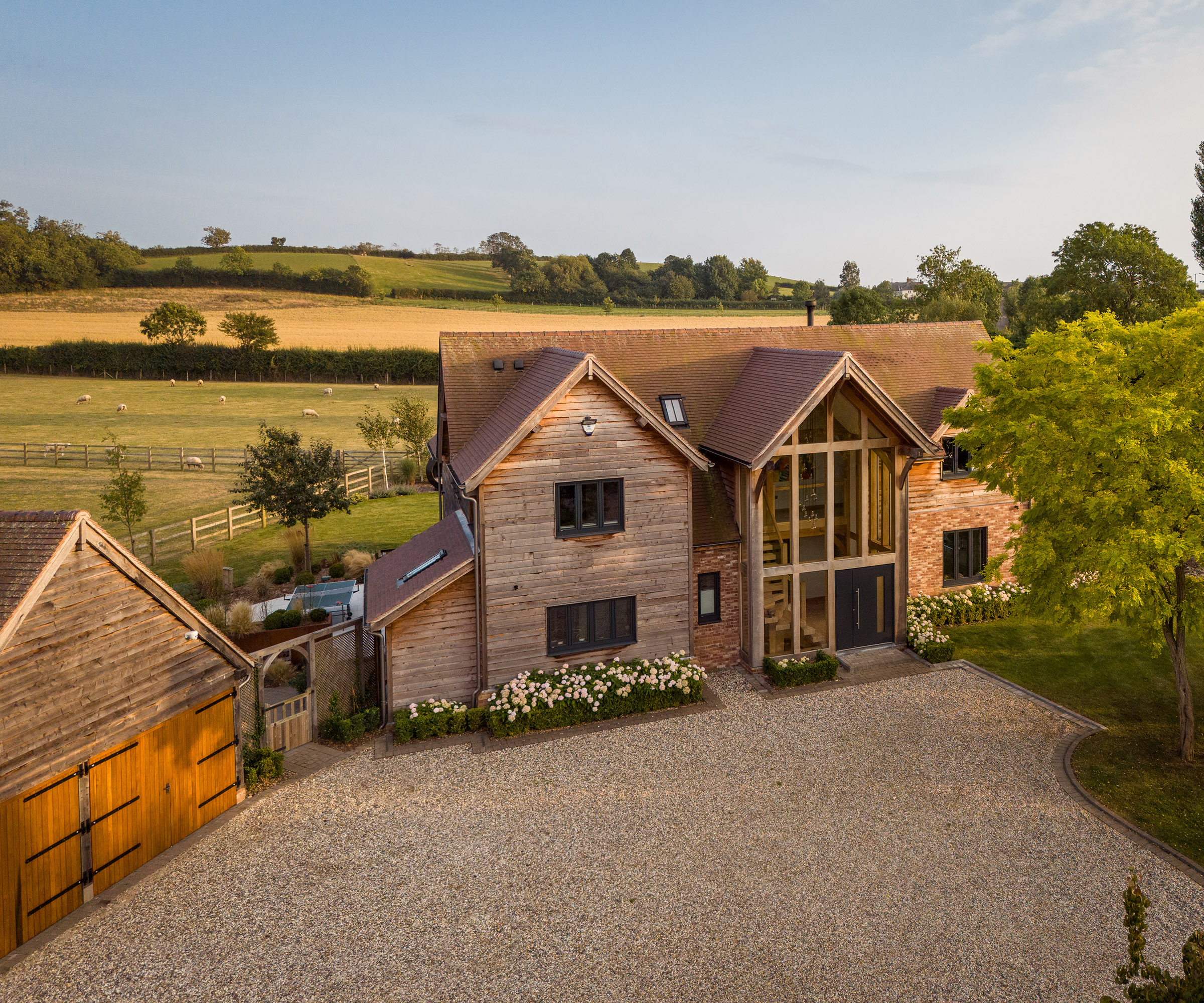 Drone shot of a large detached timber frame self build and garage