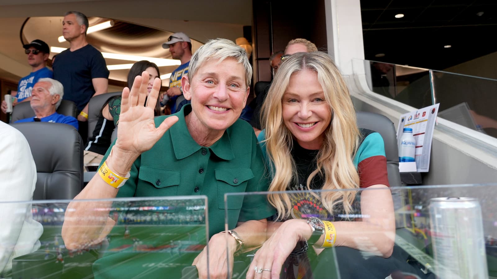Ellen DeGeneres and Portia Rossi at an NFL game