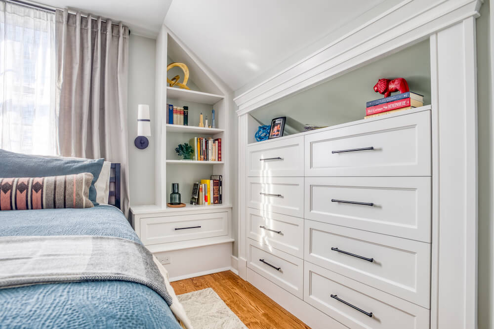 master bedroom storage with slanted ceiling