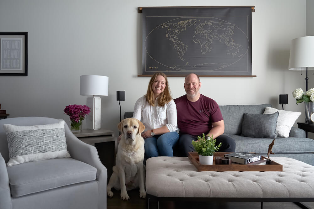 Homeowners smile in their renovated Logan Square loft