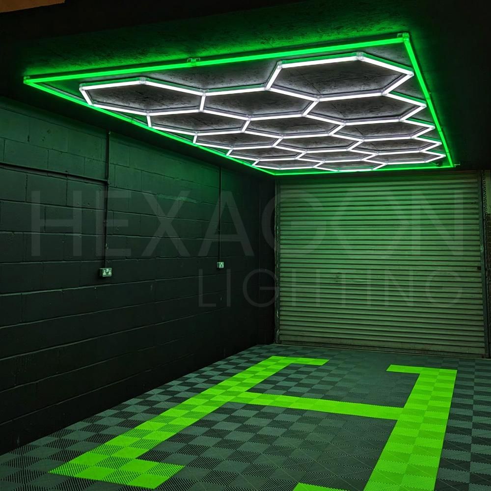 LED hexagon lighting grid with a green LED border affixed to the ceiling of a home garage