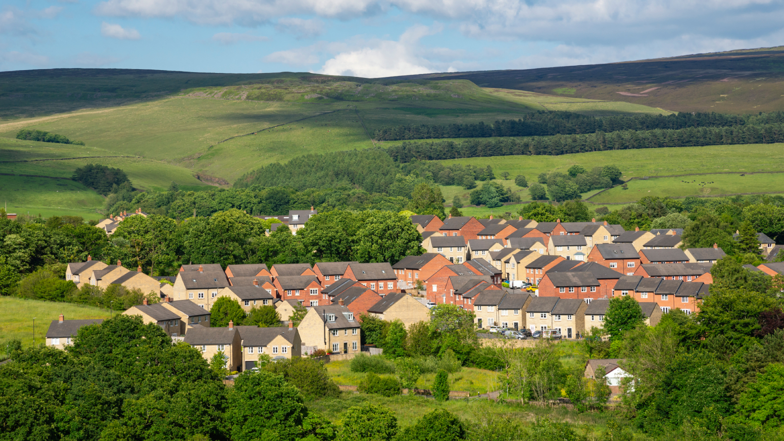 development of houses in rolling countryside hills