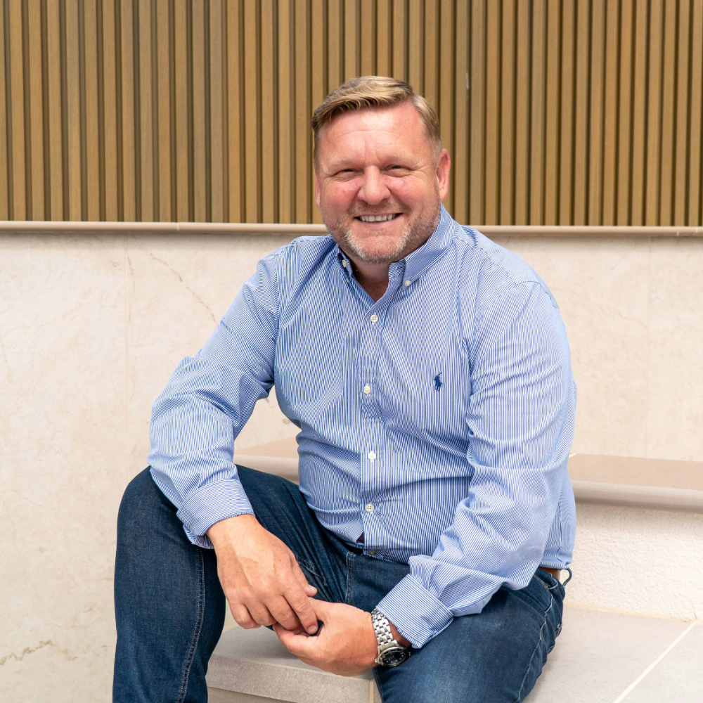 Andy McLaughlin sitting down and smiling