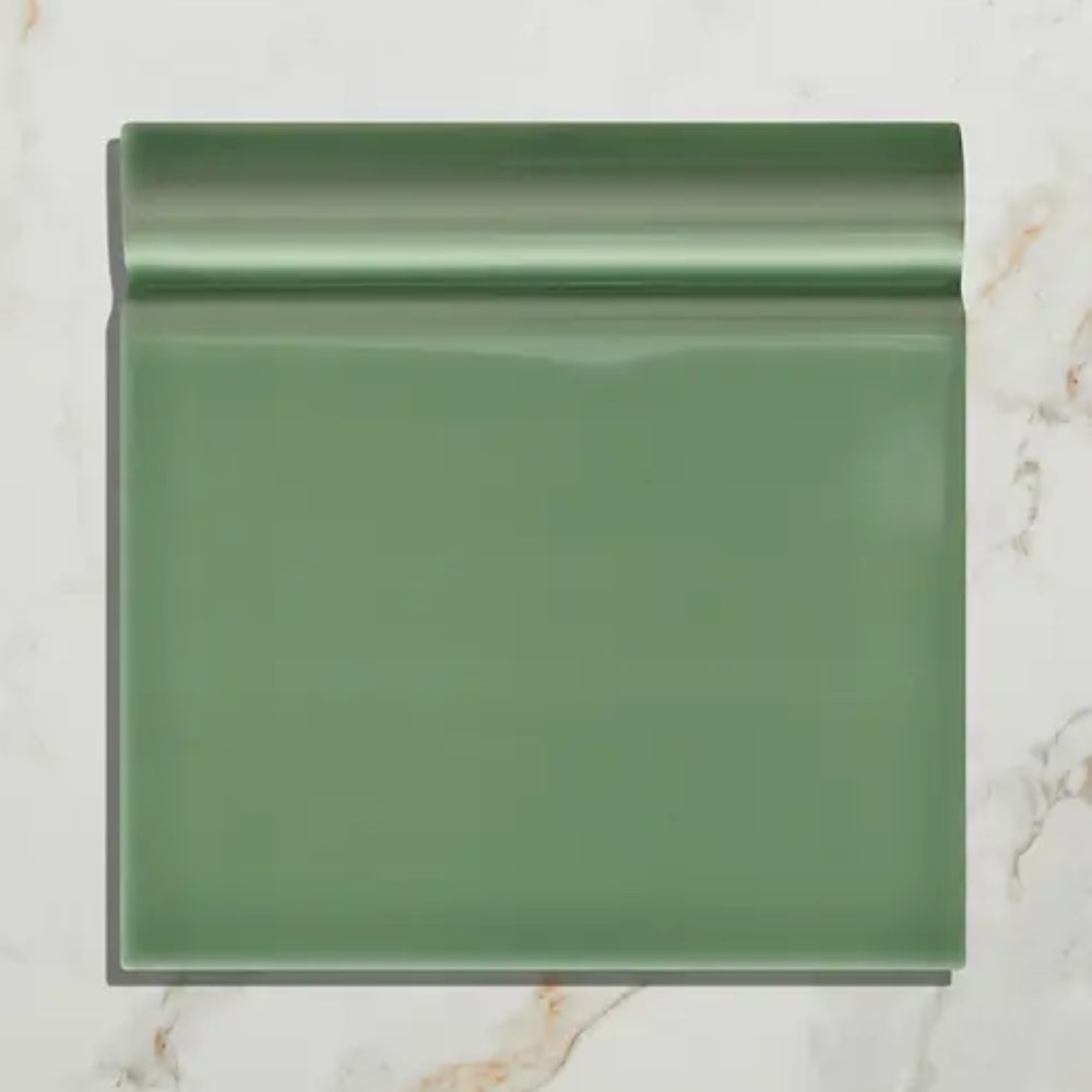 A glossy green ceramic skirting tile