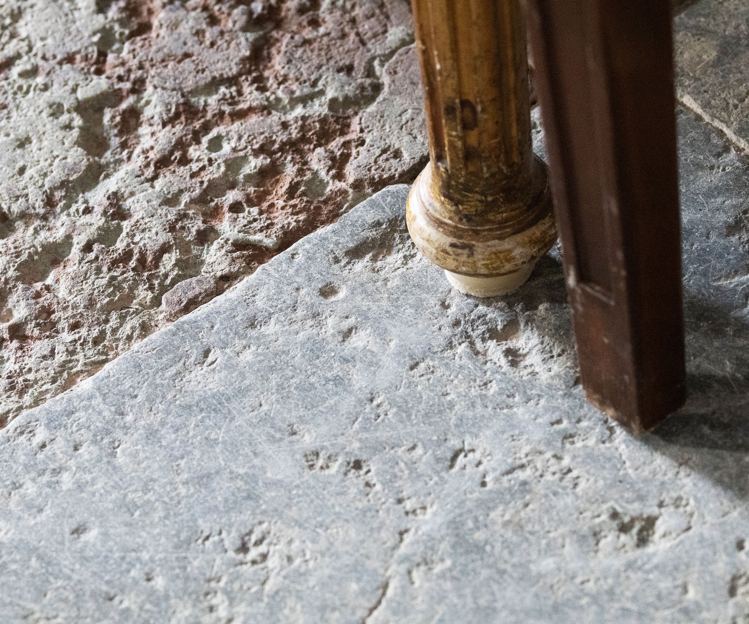 old flagstone floor under table legs