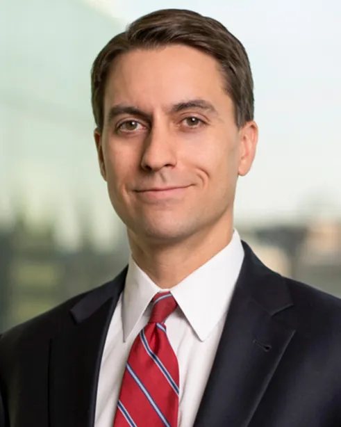 headshot of Aron Beezley