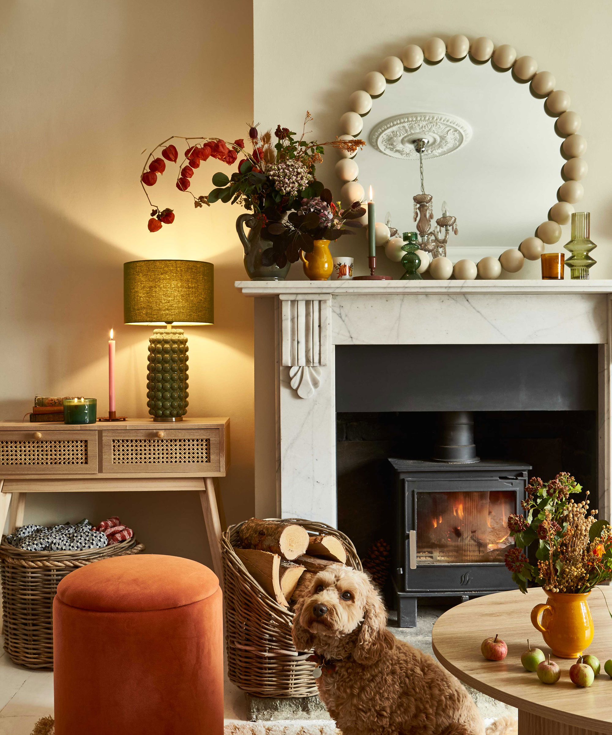 cosy living room with wood burning stove and green side lamp