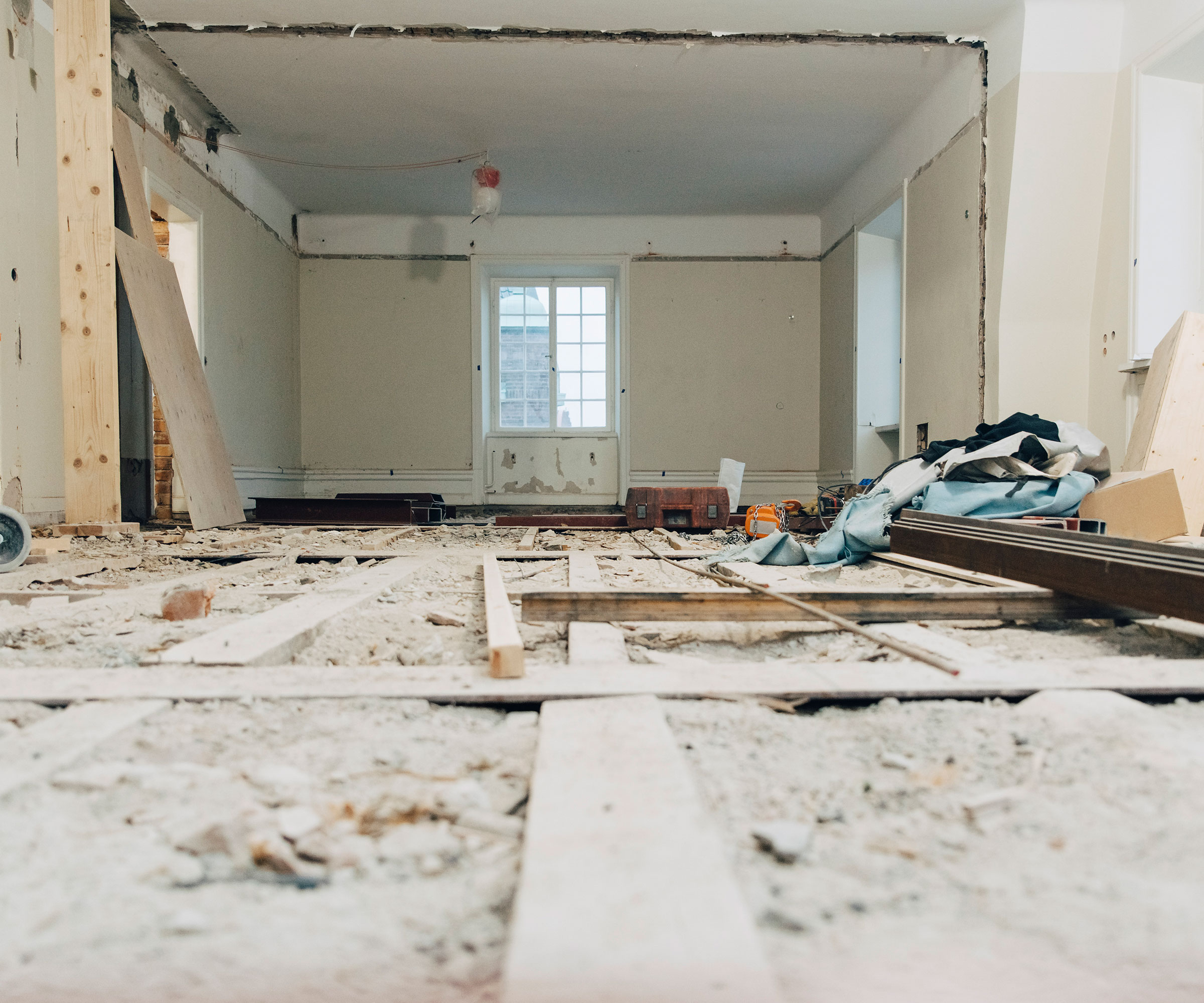 wooden floor restoration and insulation within renovation project