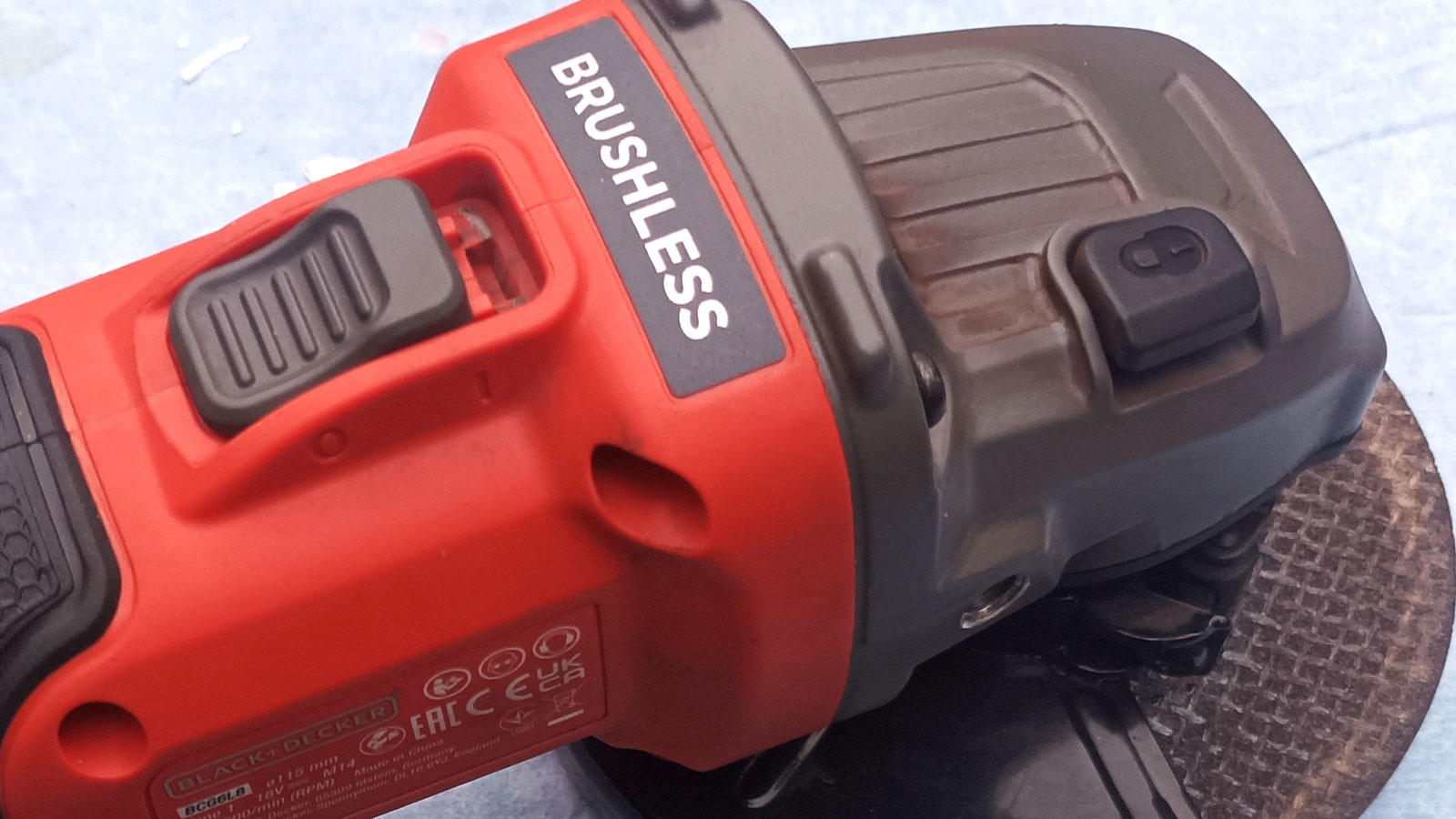 Close up of Black + Decker Cordless Brushless Angle Grinder controls