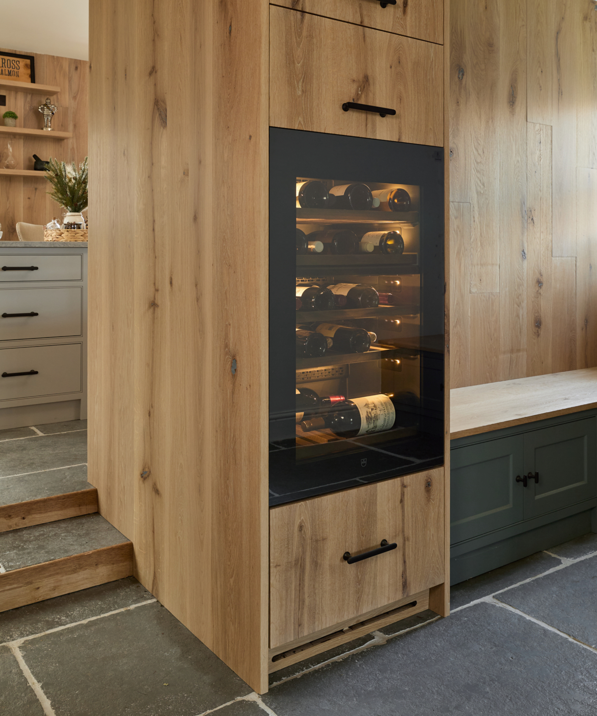 Drinks fridge built into wood cabinetry