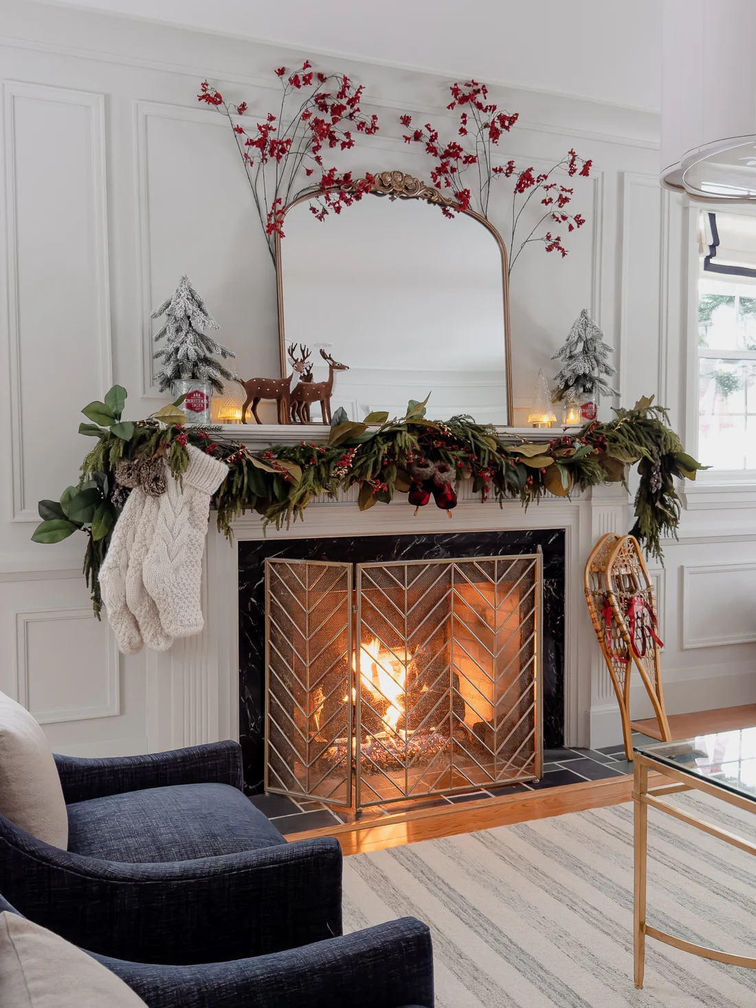 traditional red and green christmas decor, classic christmas living room decorations, cozy living room for the holidays classic traditional living room, fireplace mantel garland, red and green decorations