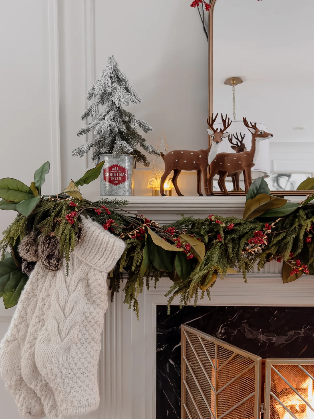traditional red and green christmas decor, classic christmas living room decorations, cozy living room for the holidays classic traditional living room, fireplace mantel garland, red and green decorations