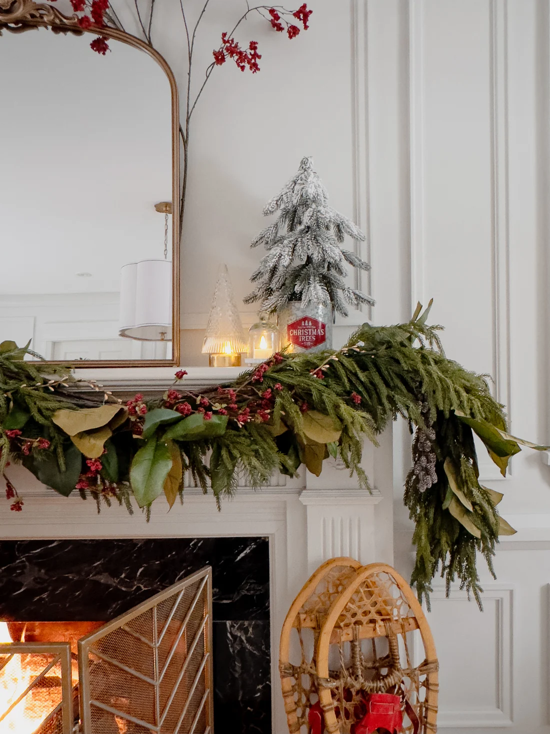 traditional red and green christmas decor, classic christmas living room decorations, cozy living room for the holidays classic traditional living room, fireplace mantel garland, red and green decorations