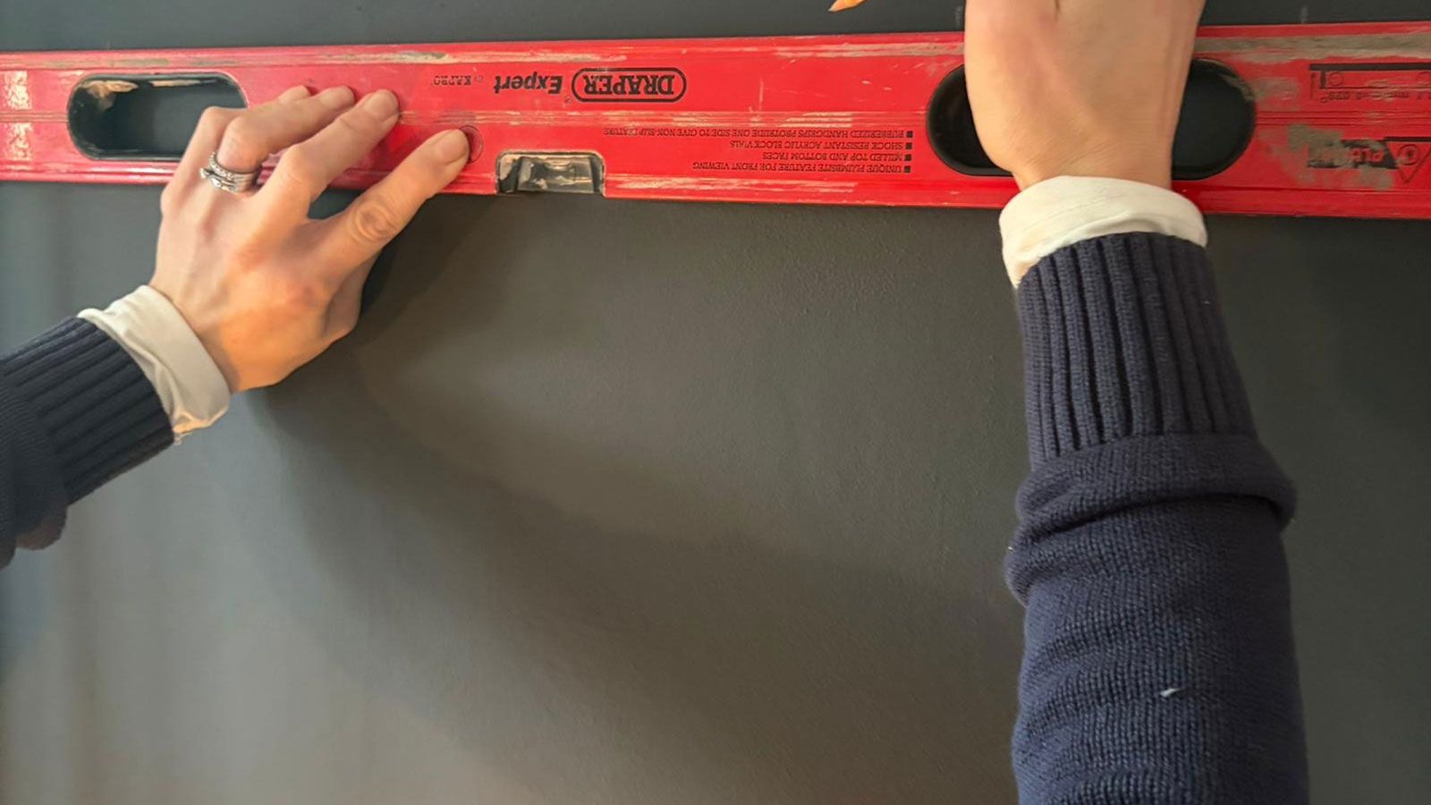 Using a wall panelling kit and moody grey paint to create a feature wall