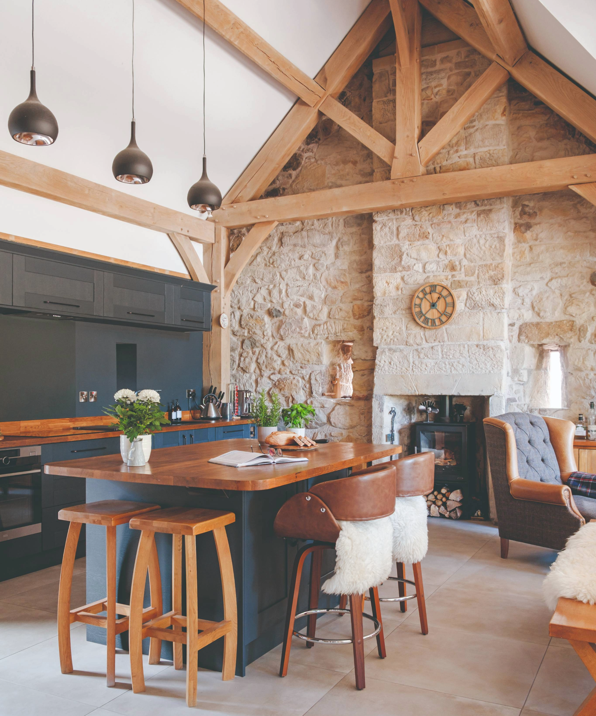 Open plan kitchen with island and log burner