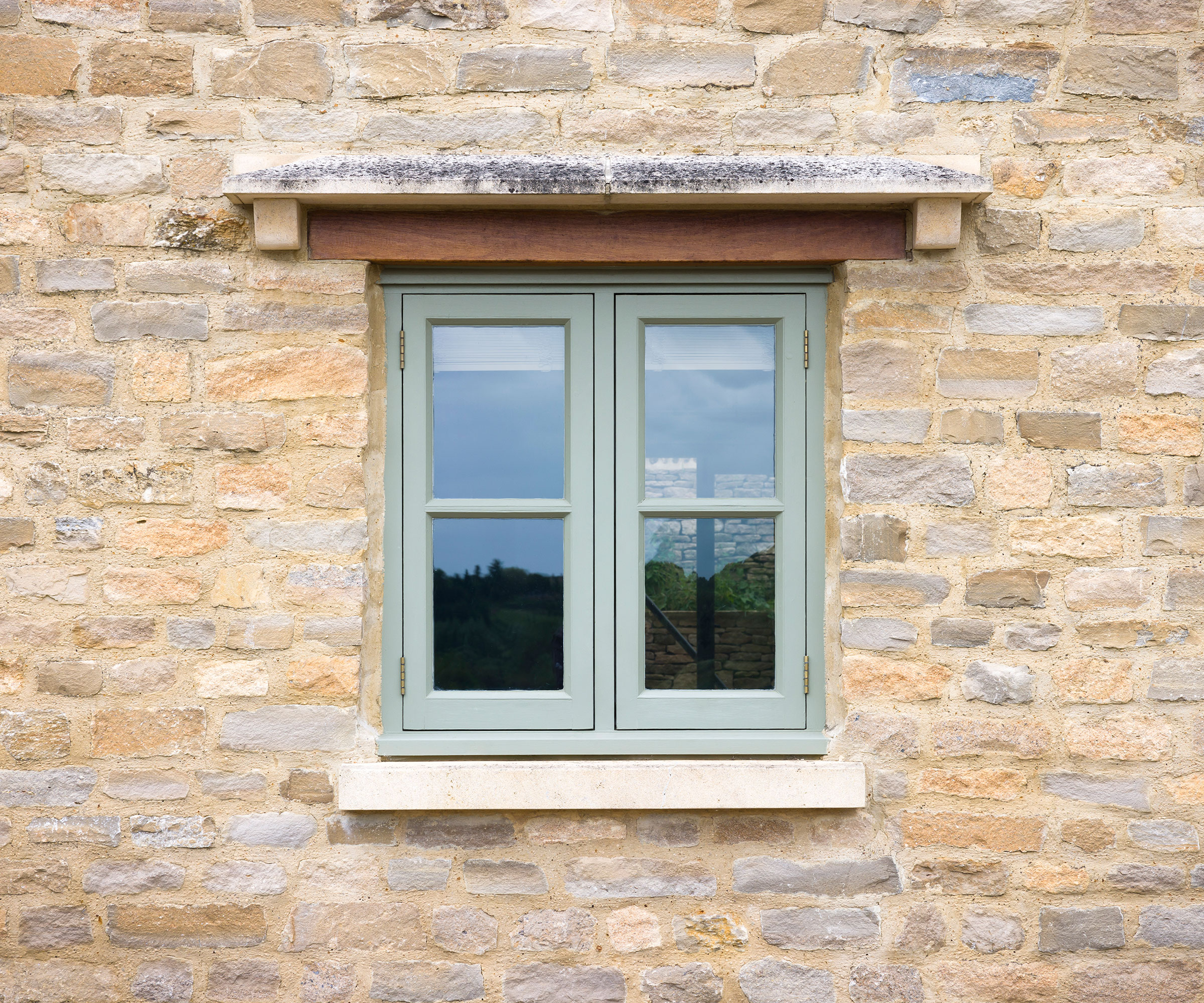 small wooden green casement window