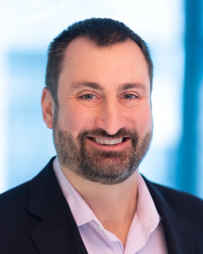 A headshot of Chris Love