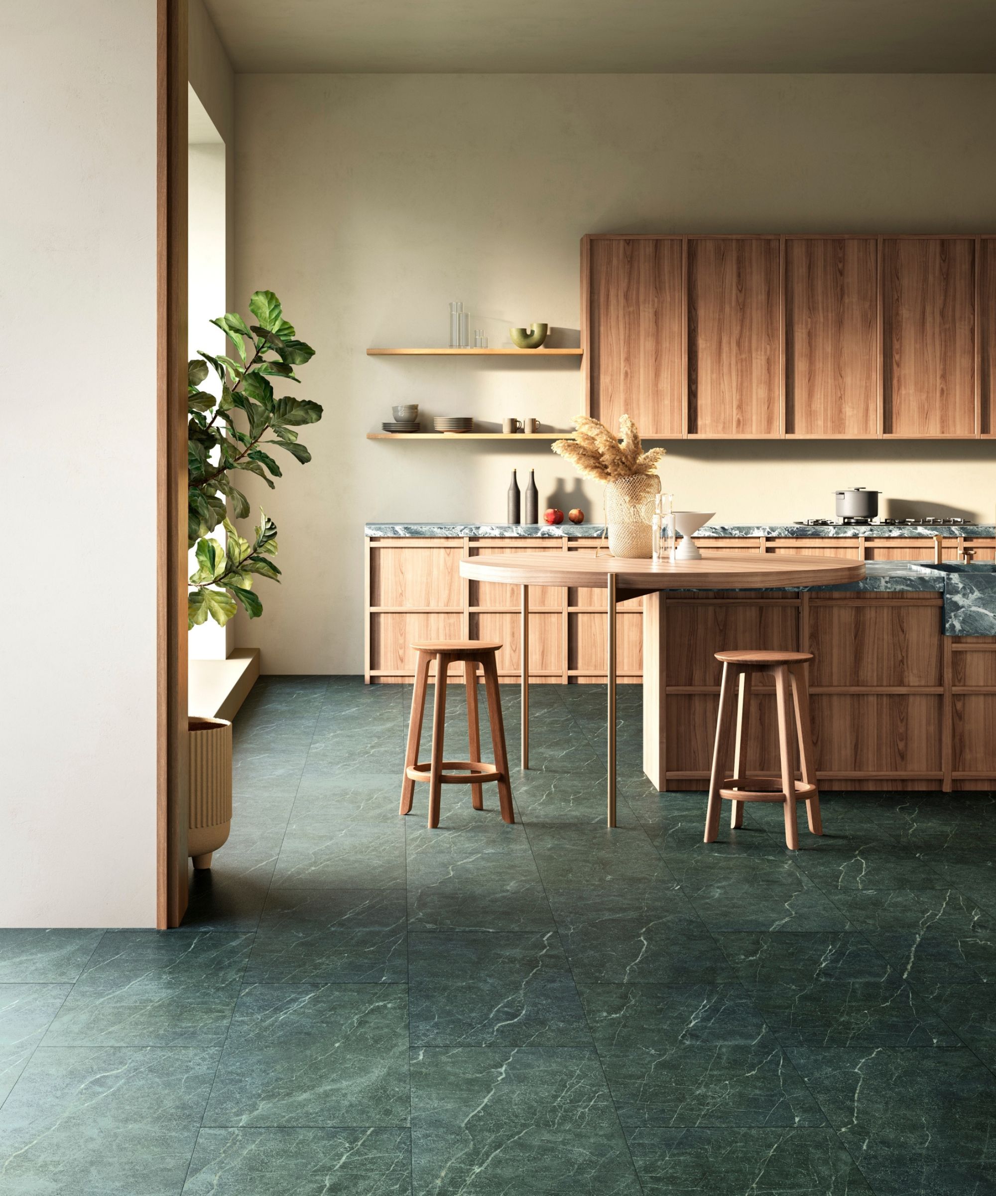 Contemporary kitchen with natural wood cabinets, open shelving, green stone flooring, and simple stools creating an earthy, modern atmosphere.